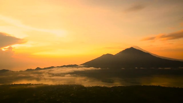 Sunrise over Lake Batur, Volcano Agung and Abang on the background. Bali Indonesia.