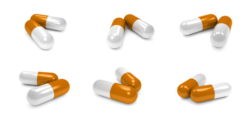 Orange pills capsules isolated on white background.