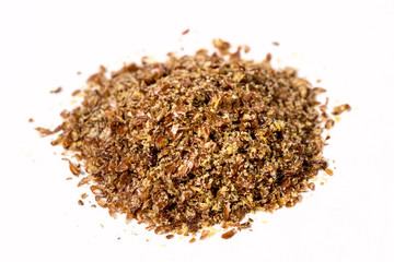 Ground flax meal isolated on white