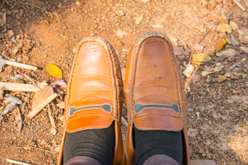 still life with brown leather shoes old