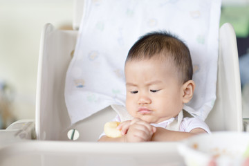 Fototapeta na wymiar Asian baby feeding time