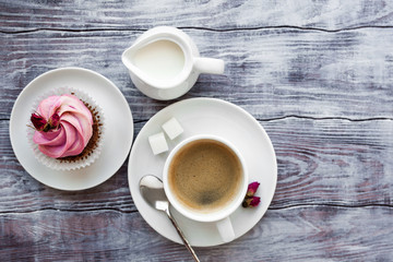 Top view of a creamy cupcake with cofee