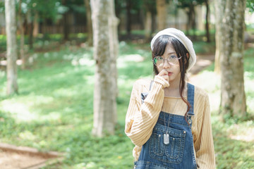 Asian girl wearing jean overalls