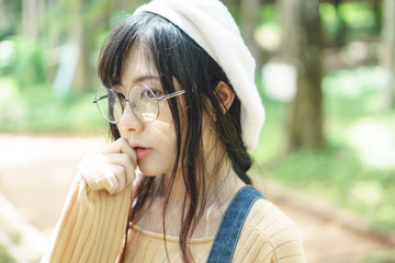 Asian girl wearing jean overalls