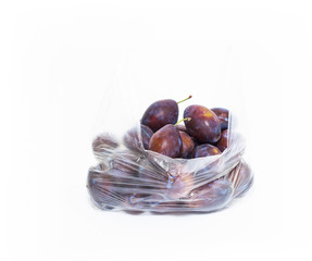 organic plum from market in plastic bag, natural 