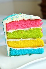 A slice of cake with white frosting