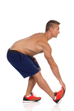 Man Stretching Thigh With Standing Hamstring Stretch Exercise