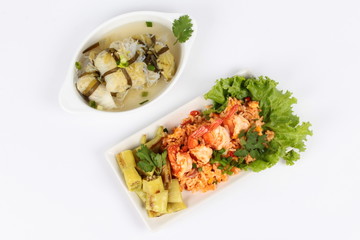 Fried rice with shrimp and grilled green sweet chili served with Streamed lettuce wrap minced pork soup on white background. Top view