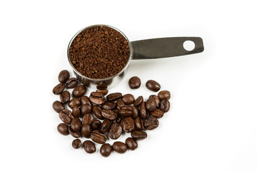 Coffee beans and grounds in a scoop isolated on white background