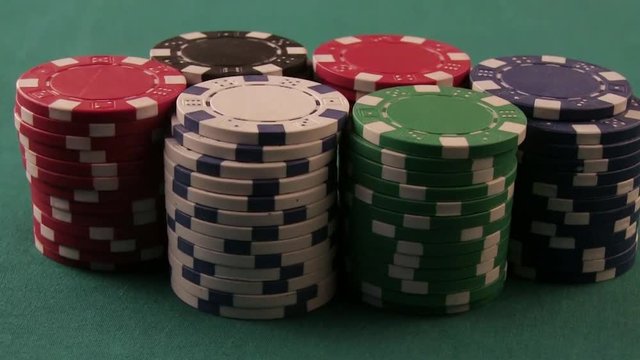 Poker Player Moves Chips On Table At Casino. Casino Chips. All-In