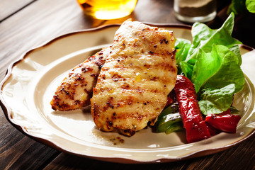 Grilled chicken breasts served with grilled paprika
