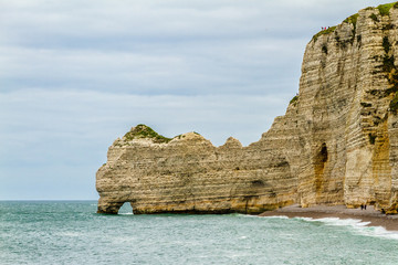 Fototapeta na wymiar Famous natural cliffs in Etretat - French seaside resort.