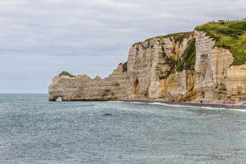 Fototapeta na wymiar Famous natural cliffs in Etretat - French seaside resort.