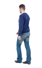 Back view of going  handsome man. walking young guy . Rear view people collection.  backside view of person.  Isolated over white background. The guy in the demi-season jacket leaves. The guy in jeans