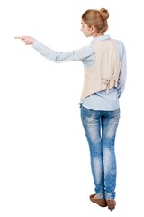 Back view of  pointing woman. beautiful girl. Rear view people collection.  backside view of person.  Isolated over white background.
