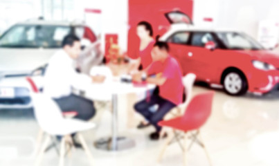  car showroom with salesman and customers