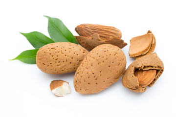 Almonds with leaves isolated on white background