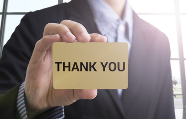 businessman hand holding a business card with a message thank you for advertise concept.