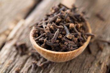 cloves in a wooden spoon