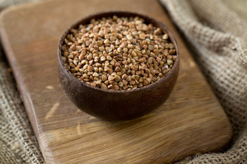 buckwheat groats on wooden surface