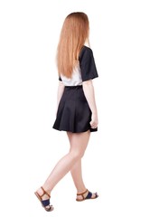 back view of walking  woman. beautiful redhead girl in motion.  backside view of person.  Rear view people collection. Isolated over white background.