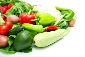 Pile of vegetables on white