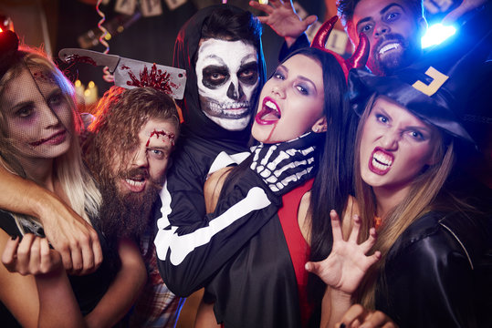 Spooky costumes of party people.