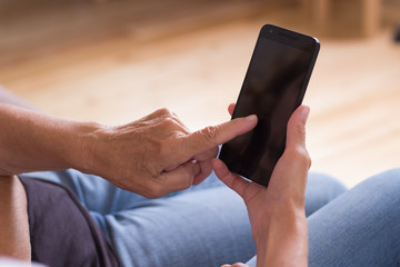 Two women study a new apps in smartphone