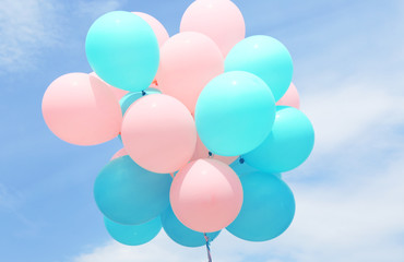 Colorful balloons against blue sky © Africa Studio