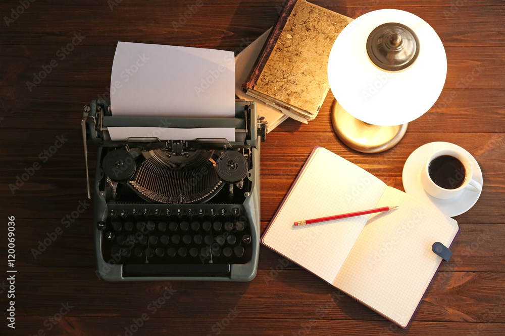 Poster old typewriter and notebook on the table, top view