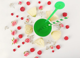 Cocktail on pattern background with berries and flowers