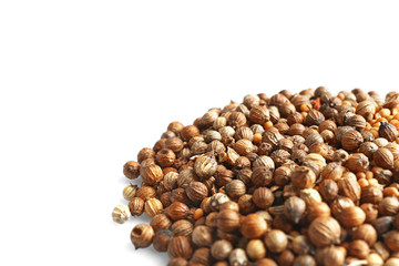 Heap of coriander seeds on white background