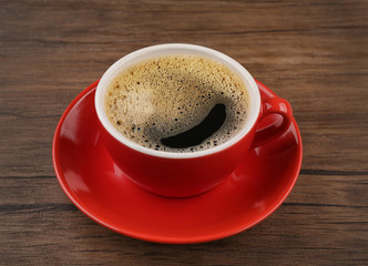 Cup of coffee wooden background