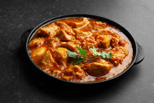 Chicken curry on dark background