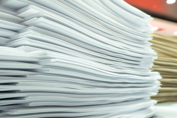 Piles of paper on my desk at work.