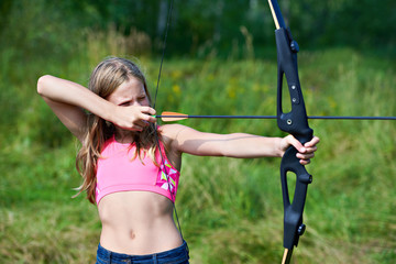 Girl teenager with bow nock and aims