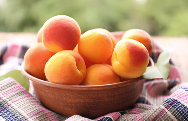 Fresh juicy apricots in bowl
