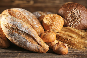 Lots of bread and spikes on the wooden table