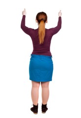 Back view of woman thumbs up. red-haired girl in a blue skirt with both hands showing thumb up.