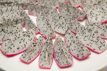 Sliced dragon fruit isolated on white background