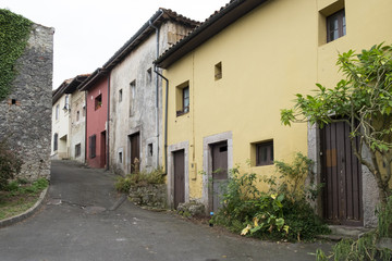 Fototapeta na wymiar Old houses in the street in Llanes, Asturias, Spain.