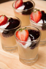 Blueberry filling and cheese served in glass