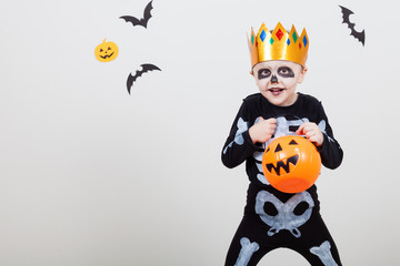 Little boy in costume skeletons.