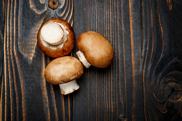 champignon mushroom on wooden background