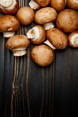 champignon mushroom on wooden background