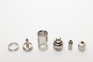 Dismantled parts of the electronic cigarette on a white backgrou