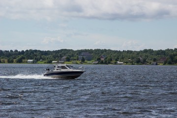 Fototapeta premium High speed boat on lake moving