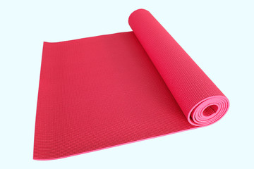 red yoga mat solated on white