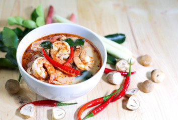 Tom yum kung, and condiment, on wooden table,Blur, Select focus