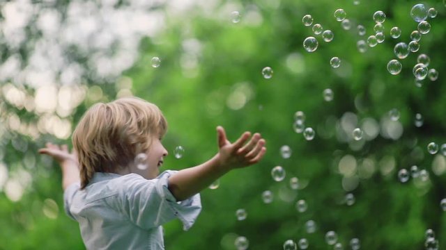 Happy boy with soap bubbles